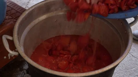 Put fresh tomatoes in a pot Stock Footage 78137266