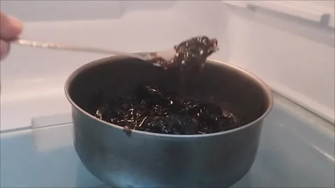 Put the grated black grass jelly in the refrigerator Stock Footage 294877154