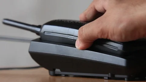 Put the handset on the base Stock Footage 97244966