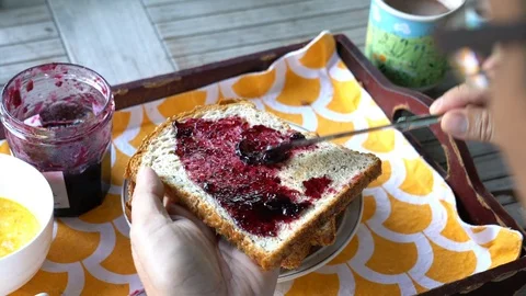Put jam to bread slice. Healthy and nutritious eating. 스톡 동영상 120280650