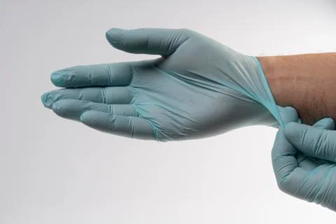 Put on latex gloves Stock Photos