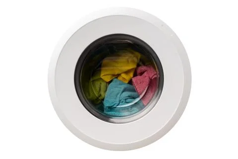 Put the laundry into the washing machine. focus on a colored towel. Stock Photos