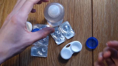 Put the lens in a container 動画素材 72545537