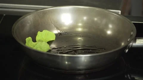 Put lime leaves ginger and lemongrass on the pan Stock Footage 220728677