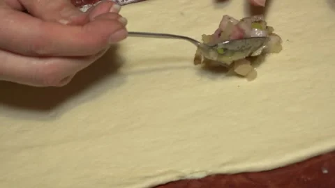 Put the meat on the dough for the pies Stock Footage 145709087
