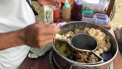 Put meatball kojek in plastic Stock Footage 224869073