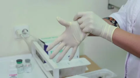 Put on a medical glove Video stock 168569192