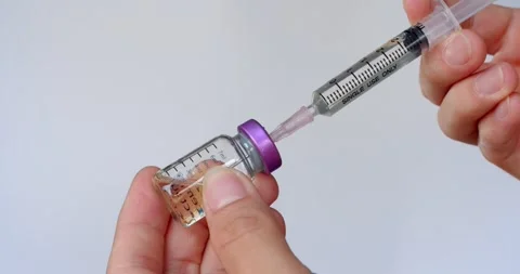 Put the medicine back into the bottle after sucking more than. Stock Footage 263574629
