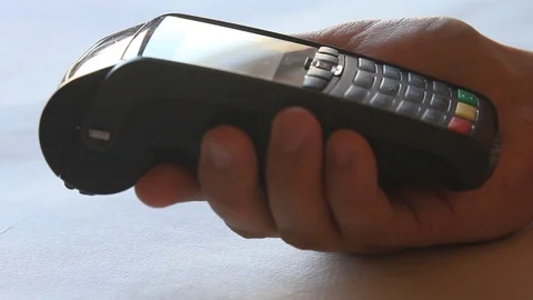 Put mobile pos terminal on the table Stock Footage 97382579