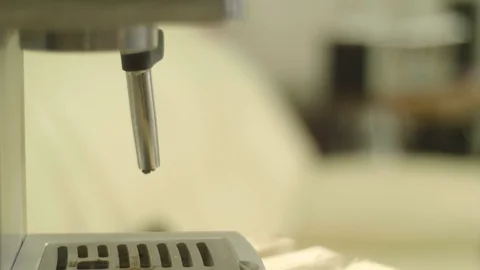 Put the mug in a cappuccino machine 4k slow motion Stock Footage 87145087
