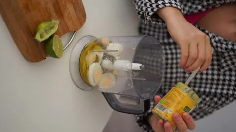 Put mustard in blender vertical video Stock Footage 258202807