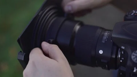 Put ND filter on the camera Video stock 119540694