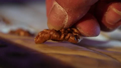 To put nuts on the dough 3 Stock Footage 320834892