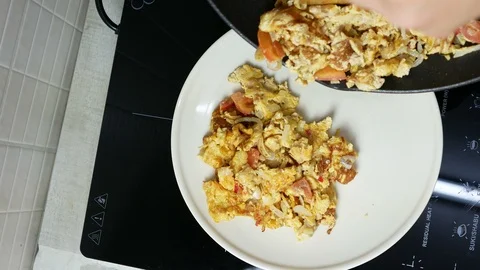 Put omelet  to white dish . Top view. Stock Footage 89953902