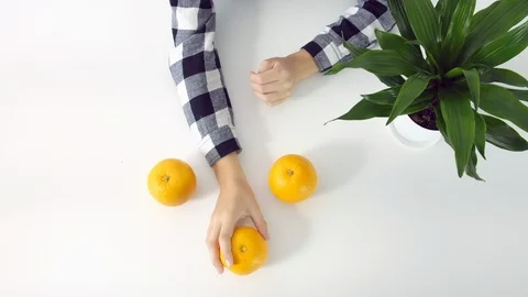Put the oranges on the table Stock Footage 102867177