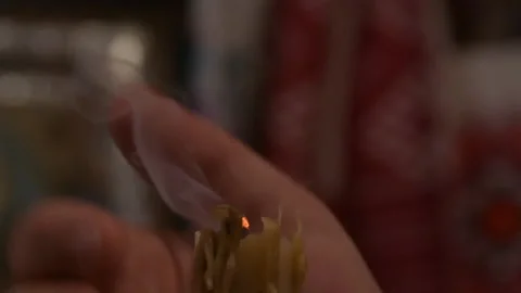 Put out the candle flame Stock Footage 145376303