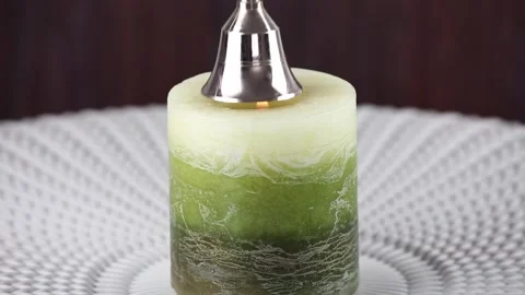 Put out candle flame wick long handle candle snuffer bell. Stock Footage 152831199