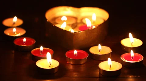 Put out candle light or fire by open heart shape box Stock Footage 34363943