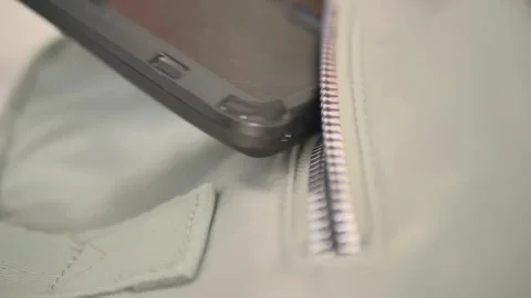 Put the phone in the pocket of the backpack Stock Footage 254804741