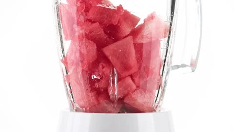 Put pieces of watermelon in blender for making smoothie Stock-Footage 137690001