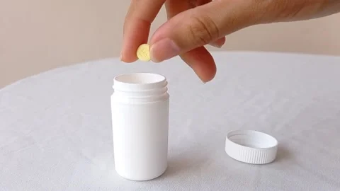 Put a pill of vitamin C into its jar Stock Footage 145562563