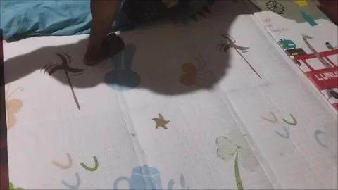 Put the pillow on the playmat Stock Footage 291592044