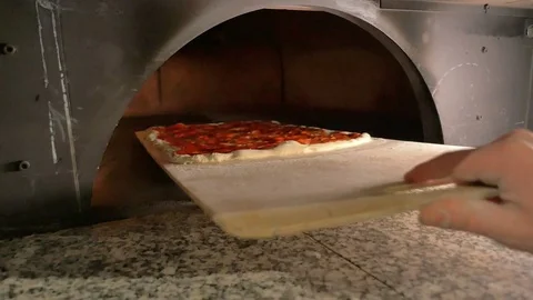 Put the pizza in the oven Stock Footage 85007420