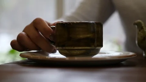 Put on a plate a cup of delicious tea or coffee. slow motion, 1920x1080, full hd Stock Footage 82869296