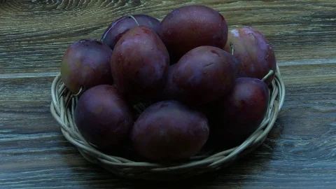 Put plum on other red plums Stock Footage 80059155