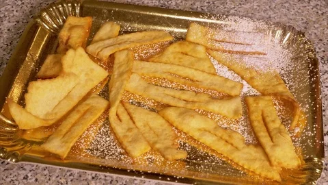 Put the powdered sugar on the fried desserts Stock Footage 85222825