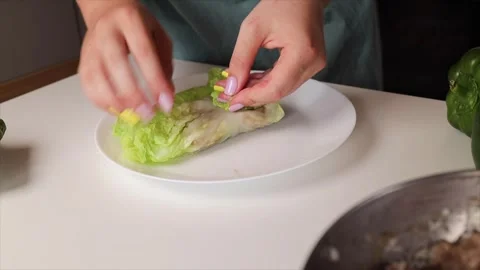 Put the raw minced meat in a boiled Italiano cabbage leaf. Stock Footage 280649725