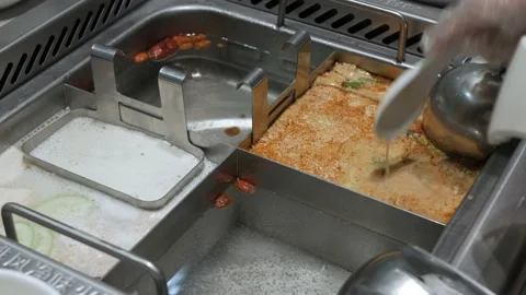 Put raw shrimp ball into hot boil spicy soup.szechuan chinese hotpot syle Stock Footage 203724152