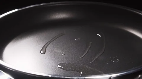 Put the raw strip steak in the pan Stock Footage 84778918