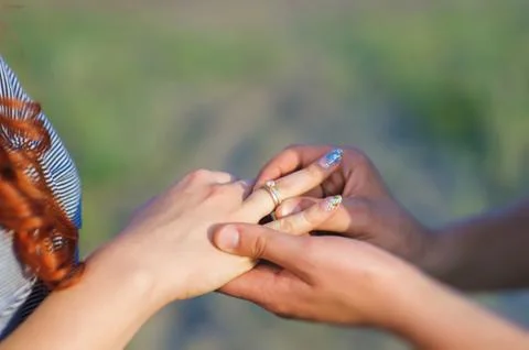 Put ring on hand. Stock Photos