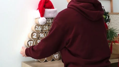 To put on the shelf a decorated Eco-friendly handmade Advent calendar made of Stock Footage 316891681