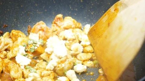 Put sliced corn and long yard beans into the black teflon pan and stir fried Video stock 89498599