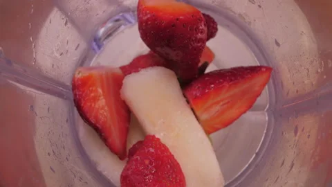 Put sliced fruit into blender 4k Video stock 149630159