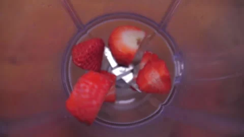 Put sliced strawberry into blender  Stock Footage 149704896