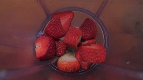 Put sliced strawberry into blender slow motion 4k Stock Footage 149677982