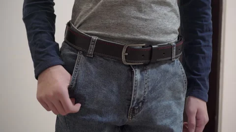 Put the smartphone in the pocket Stock Footage 245357320