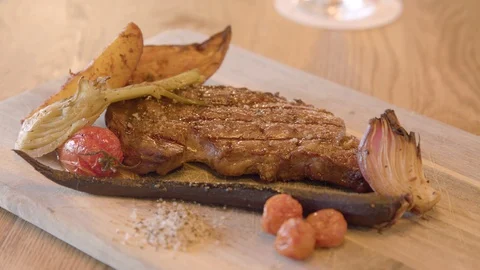 Put solt on steak Chef's dish Stock Footage 92197591