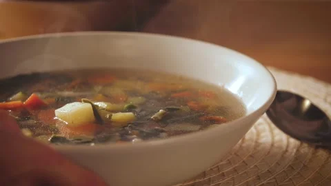 Put on table dish of minestrone. Vegetarian healthy meal for dinner. Ready  Stock Footage 143556485