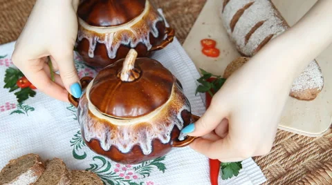 Put on the table the pot with meatless soup. Stock Footage 61947435