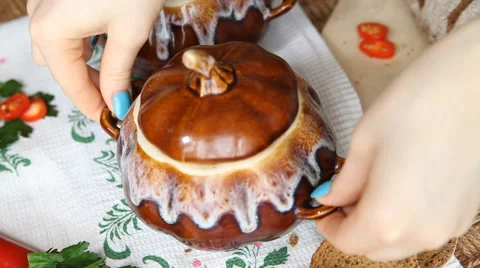 Put on the table the pot with meatless soup. Stock Footage 62093514