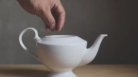 Put tea into pot Stock Footage 242177680