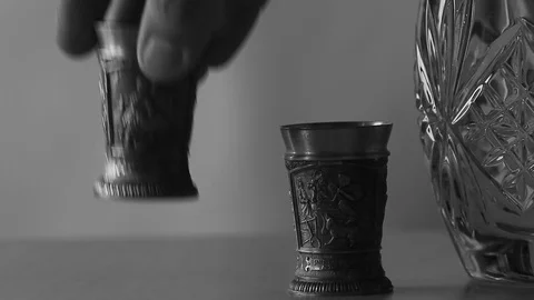 Put a tin glass on the table Stock Footage 98039225