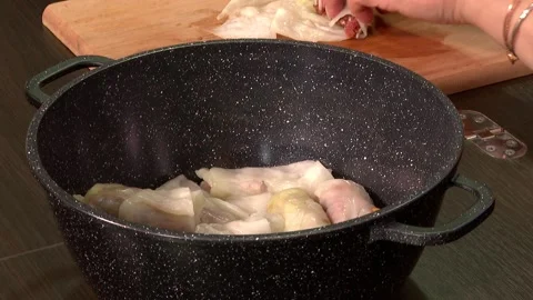 Put tolma in the pot 1 Stock Footage 325611232