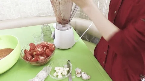 Put the tomatoes in the blender Stock Footage 79632447