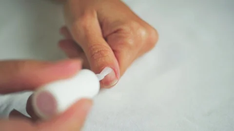 Put transparent polish on the thumbnail 1- 50 Stock Footage 98740017