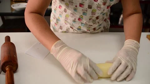 Put the tuna and cheese stuffing on the buns for baking. Stock Footage 158015915